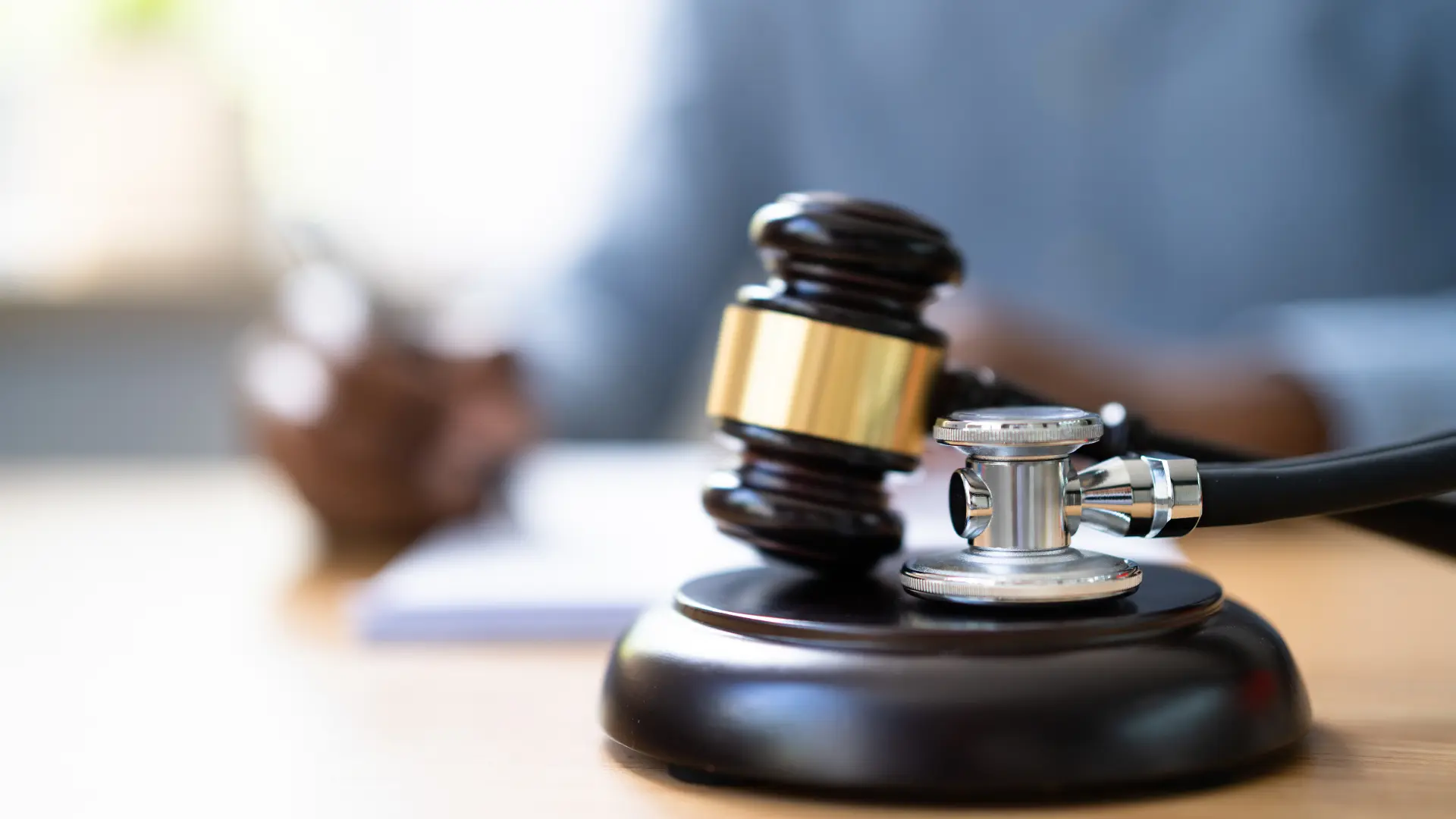 Judge’s gavel with stethoscope symbolizing medical law